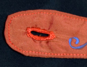 A buttonhole worked on silk taffeta