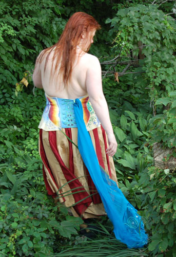 a woman wearing the Hera garments in a garden, seen from behind