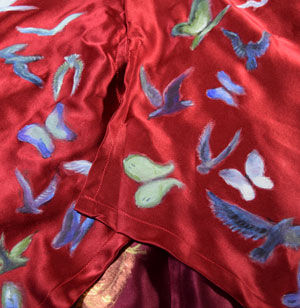 birds and butterflies painted on scarlet satin