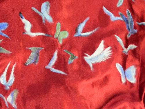 birds and butterflies painted on scarlet satin