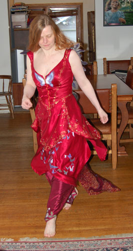 a woman in the Psyche garments, dancing in a room